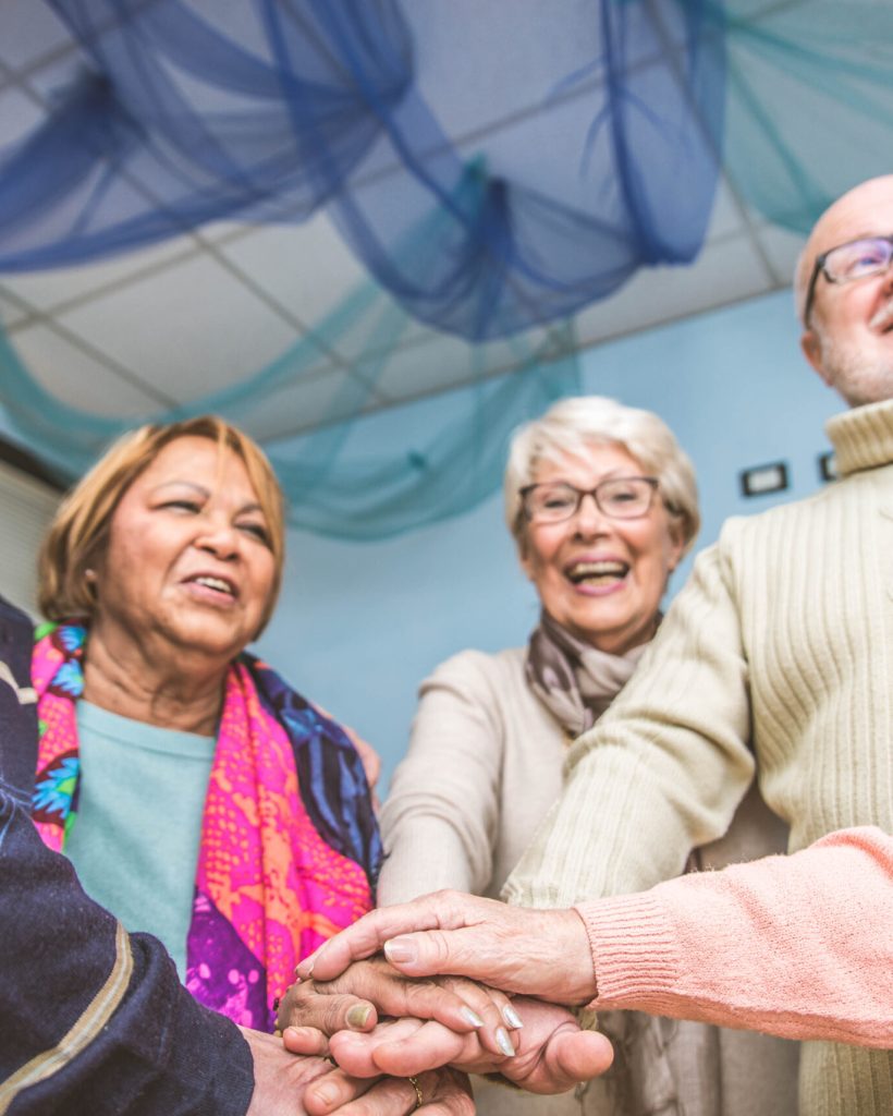 Senior adults in a nursing home for the elderly doing leisure activities